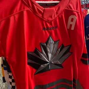 Mcdavid 2026 Bauer Red Jersey with Black Leaf Emblem